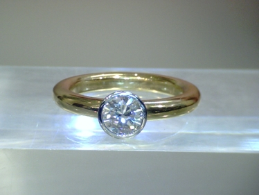 LUXORA Ring mit Brillant ca. 0,737 ct. 750 GG/WG # 54