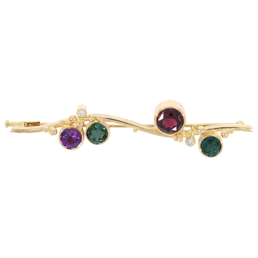 Brosche mit 2 Brillanten ca. 0,08 ct. , 1 Amethyst, 2 Turmaline und 1 Granat aus 750 Gelbgold