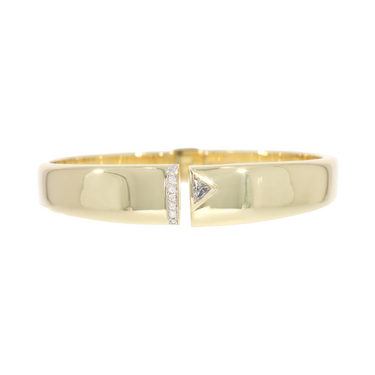 Armspange mit 7 Brillanten ca. 0,14 ct. und 1 Diamant in Dreiecksform ca. 0,20 ct. aus 585 Gelbgold